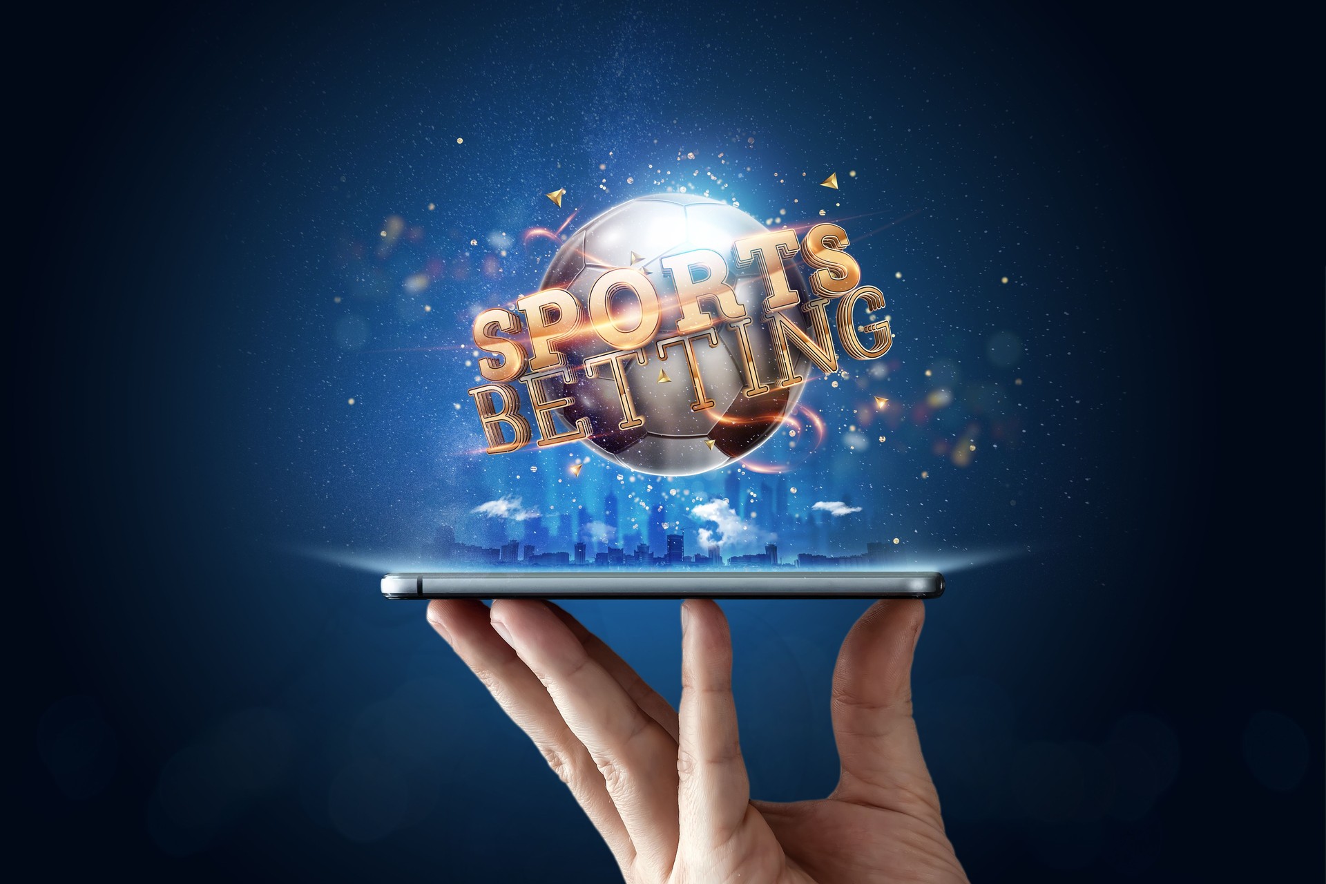 Smartphone in hand a gold inscription Sports Betting with a 3D soccer ball on a blue background. Bets, sports betting, bookmaker. Mixed media
